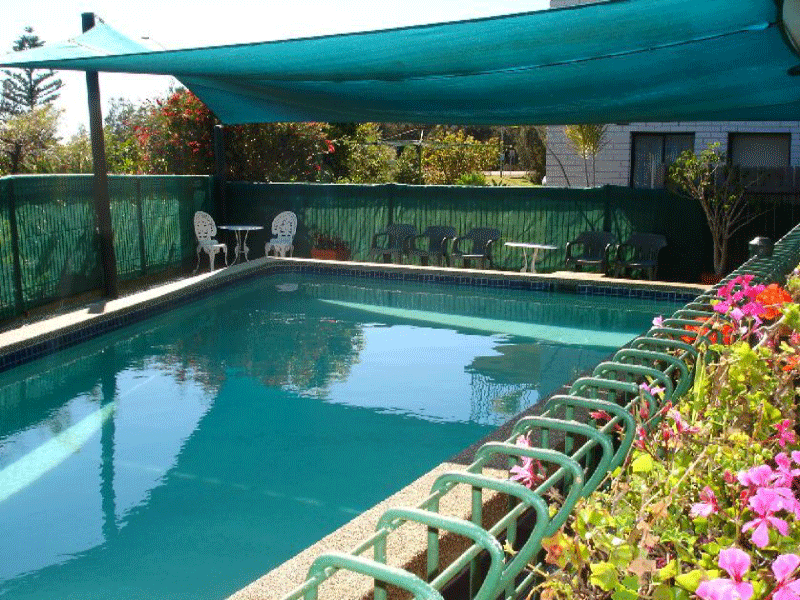 Outdoor swimming pool with sun loungers